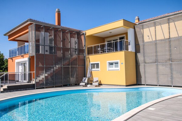 Residence Elody with Common Pool in Funtana / Two-Bedroom Apartment Residence Elody VI with Balcony and Pool View