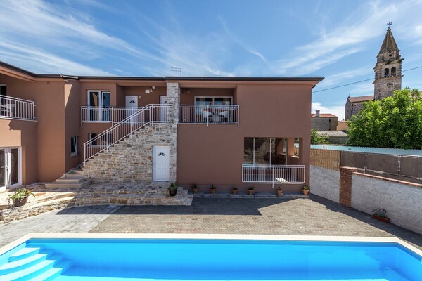 Apartment Complex with Common Pool in Tar-Torre / Two-Bedroom Apartment in Villa Valtrazza Noa IV with Balcony and Pool View