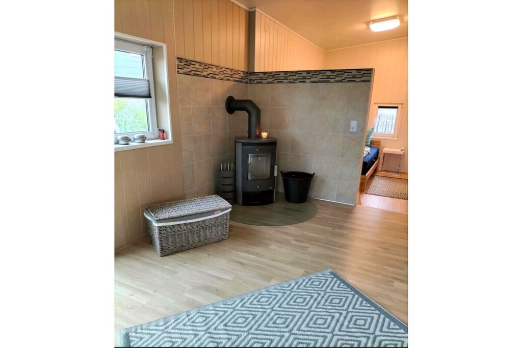 Ground floor: (hallway, dining room(TV, dining table), Kitchen(hob, oven, dishwasher, fridge), Living/diningroom(dining table), bedroom(double bed), bathroom(shower))\n\nterrace, garden, garden furniture