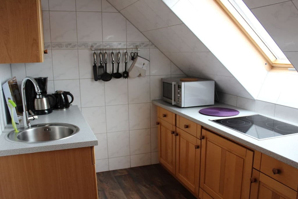 Attic: (Kitchen(hob, electric kettle, toaster, coffee machine, oven, microwave, dishwasher, fridge), Living/diningroom(TV, dining table, radio), bedroom(double bed, radio), bathroom(shower, washbasin, toilet, hairdryer, Towels incl.))\n\nterrace, garden furniture, sun loungers