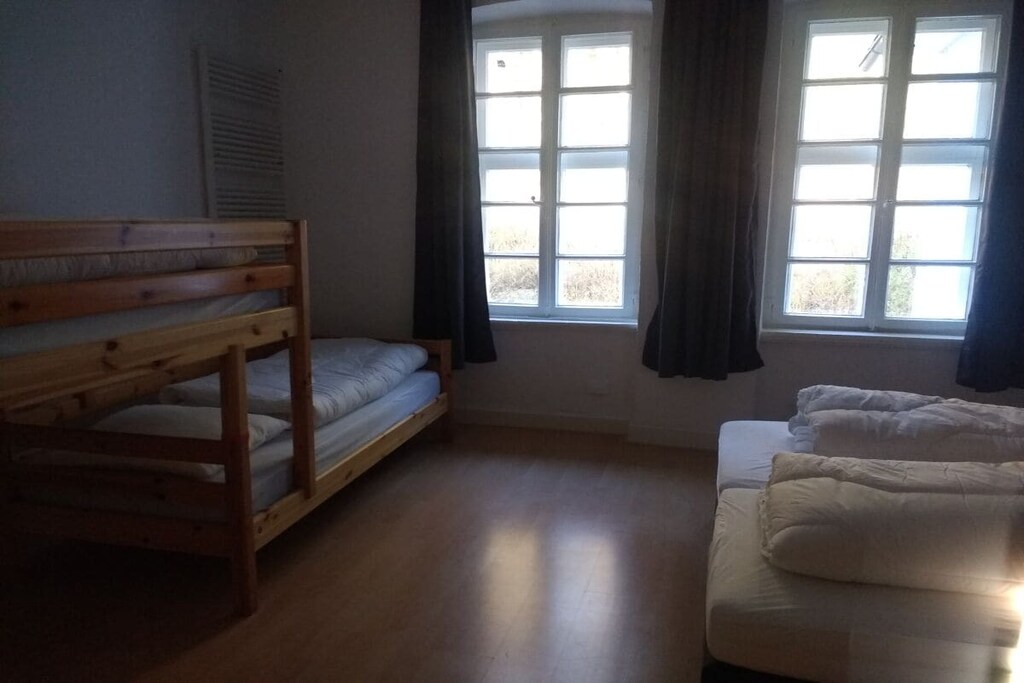 On the 1st floor: (Living room(single sofa bed, TV), Living room(dining table, high chair, party games, toys), Kitchen(hob, electric kettle, toaster, coffee machine, oven, microwave, dishwasher, fridge, freezer), bedroom(double bed, washbasin), bedroom(single bed, single bed, bunk bed), bathroom(bath tub, shower, washbasin, toilet))\n\ngrill, terrace, terrace, garden, garden furniture, trampoline, table tennis table