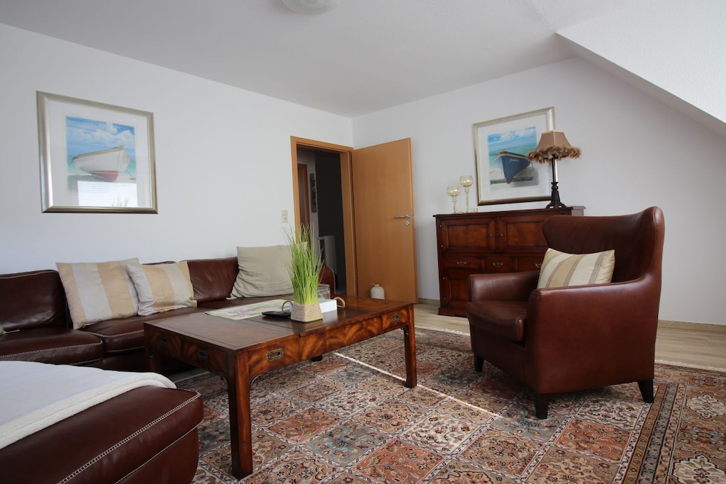 Top holiday home with flair and a fantastic roof terrace with beach chair and electric Weber grill, separate entrance, WiFi, parking space and much more.