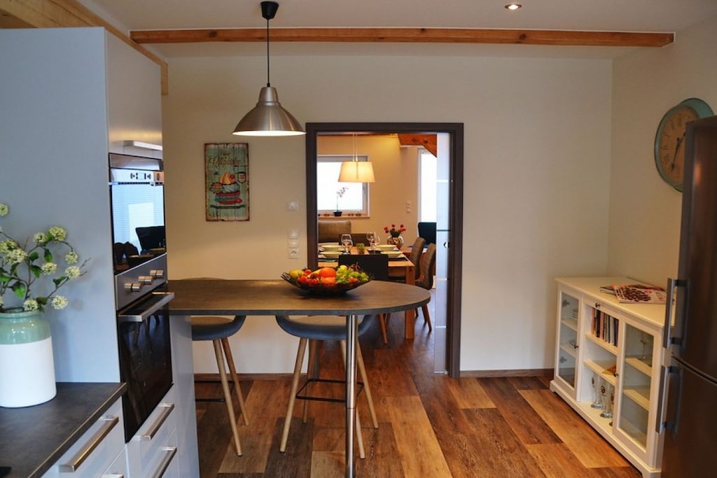 Ground floor: (Kitchen(electric kettle, toaster, coffee machine, oven, microwave, fridge, freezer, heating), Living/diningroom(single sofa bed, TV, dining table, heating), bathroom(shower, washbasin, toilet, Towels incl., heating))\n\nOn the 1st floor: (bedroom(double bed, TV, heating), bedroom(single sofa bed, double bed, TV, heating), bathroom(bath tub, washbasin, toilet, heating, hairdryer, Towels incl.))