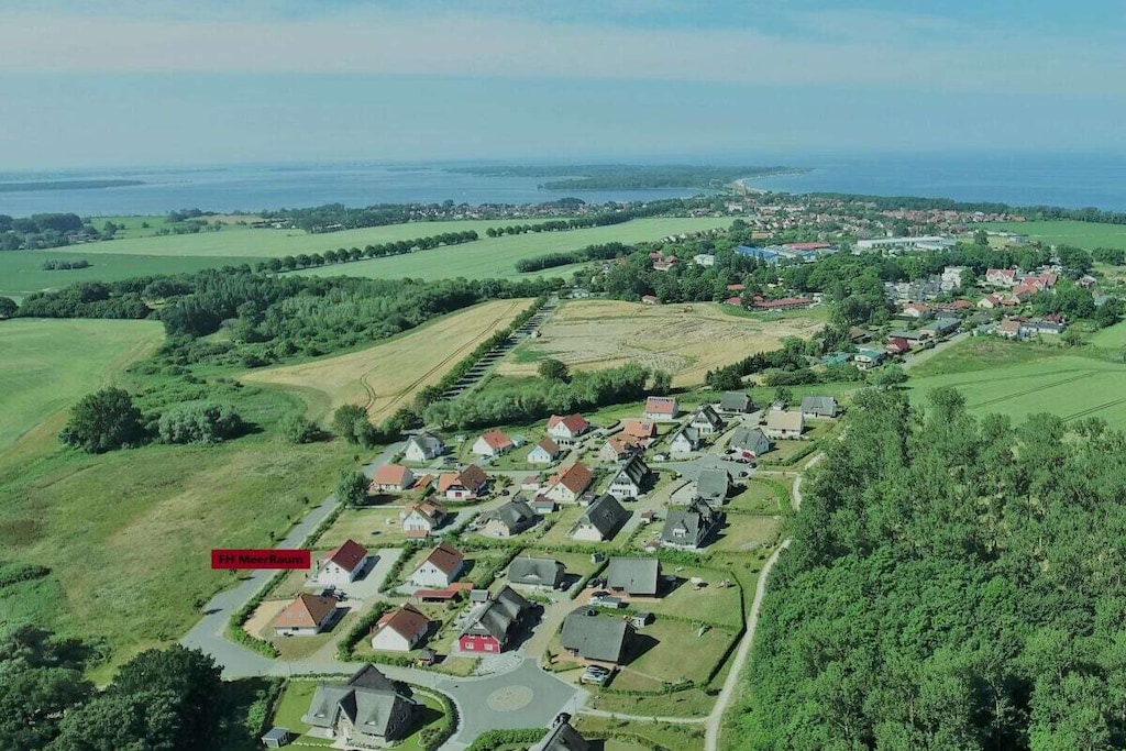 The holiday home Meerraum was newly built in 2018 on an approximately 870m² plot of land and is located in the new Baltic Sea holiday park Rerik, within a nature reserve, nestled among meadows, fields, and forests.

The Baltic Sea beach (beach access Teufelsschlucht) can be reached on foot in about 10 minutes.

The holiday home offers two separate living units with individual entrances and private terraces. The bright, approximately 100m² holiday apartment MeerRaum 2 is located on the ground and upper floors and features three bedrooms, a 20m² bright spa bathroom on the upper floor with a walk-in shower, bathroom furniture, wall-hung toilet, and two spa loungers.
... Light-filled, modern living/dining area on the ground floor with an open-plan, high-end fitted kitchen, large extendable dining table, sofa, and TV with access to two spacious sun terraces; guest WC on the ground floor; gallery on the upper floor with a second bright living area and comfortable seating area, armchair, and TV; Wi-Fi; utility room with washing machine; parking space; patio furniture and beach chair; garden.

The holiday apartment is furnished in a modern Baltic Sea style and offers everything 6-7 people need for a wonderful, relaxing holiday. For larger families or holidays with friends, you can also rent MeerRaum 1 (property number 233128) in addition to MeerRaum 2, providing 5 bedrooms and an additional 52m² of living space.

Please inquire about this rental option separately. Leave everyday life behind and enjoy a relaxing stay. Your host