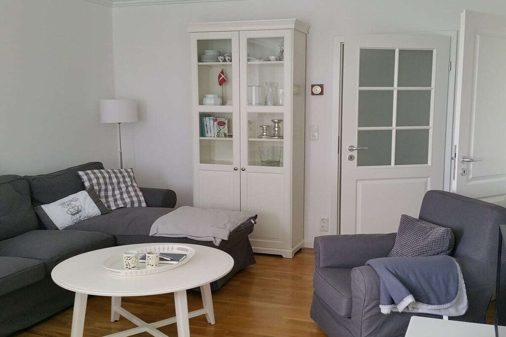 Ground floor: (relaxation area(Armchair, Mirror, Relaxation Room, toilet, sauna, shower, washbasin), drying room(tumble dryer, washing machine, drying cabinet), storage, lounge set(Table tennis))\n\nAttic: (hallway(Mirror, Wardrobe, Wardrobe Coatrack), Living room(Armchair, Games, Sofa, library, TV, dining table, DVD player, DVD player, Blu-ray player, radio, CD player), Kitchen(Mixer, Spices, Tea Towels, hob, electric kettle, toaster, toaster, cooker, coffee machine, oven, dishwasher, fridge, freezer), bedroom(Armchair, Bed Linen, double bed), bedroom(Bed Linen, single bed, single bed), bathroom(Mirror, toilet, shower, washbasin, hairdryer))\n\nFire Alarm, Hot Water, Internet Access DSL, Vacuum Cleaner, Internet access, Internet access, tumble dryer, washing machine, balcony(Sun Umbrella, garden furniture), garden(Lawn), garden(sand pit, slide, Swing set), drying cabinet, parking (paying)