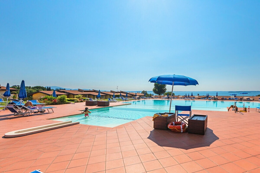 Ground floor: (Living room(double sofa bed, TV), Kitchen(hob, electric kettle, toaster, coffee machine, oven, microwave, fridge, freezer, dishes and cutlery), bedroom(double bed), bathroom(shower))\n\nInternet access, Internet access, washing machine, terrace, garden(garden furniture, swimming pool), ironing board, iron