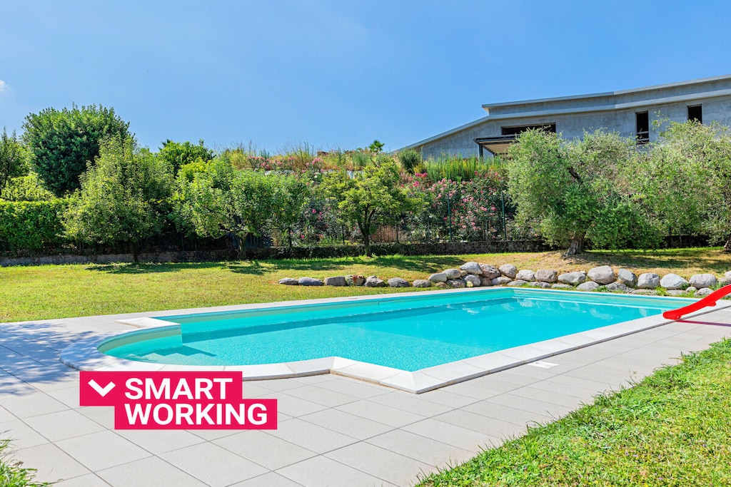 Ground floor: (Living room(TV), Kitchen(hob, electric kettle, toaster, coffee machine, microwave, dishwasher, fridge, freezer, dishes and cutlery), bedroom(double bed), bedroom(double bed), bedroom(double bed), bedroom(single sofa bed), bedroom(single bed, single bed), bathroom(bath tub, shower, hairdryer), bathroom(bath tub, shower, hairdryer), bathroom(bath tub, shower, hairdryer))\n\nInternet access, Internet access, washing machine, garden(garden furniture, swimming pool), iron