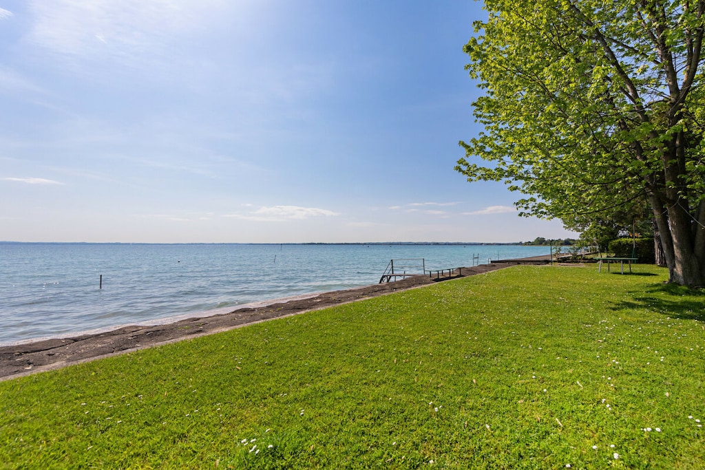 Ground floor: (Living room(TV), Kitchen(stove, electric kettle, toaster, oven, microwave, fridge, freezer, Food processor, dishes and cutlery), bedroom(bunk bed), bedroom(double bed), bathroom(shower))\n\ngarden, garden furniture, sun loungers