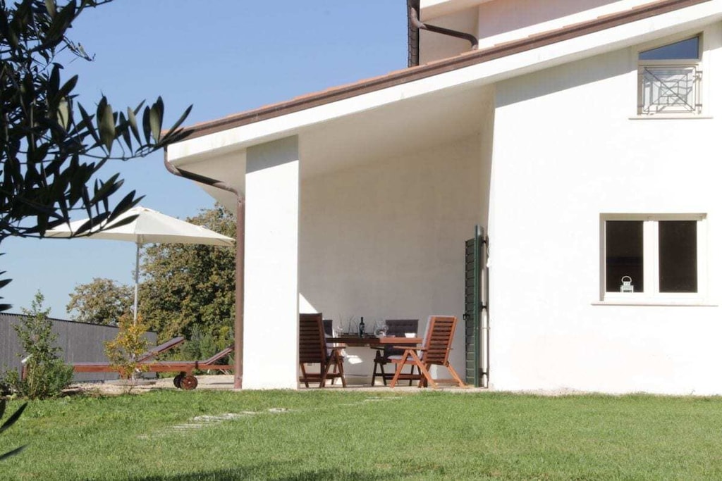 The new, independent and modernly furnished holiday apartment Olivi is on the ground floor and is suitable for up to 4 people. In total, the holiday apartment has 70 square meters (sqm) of living space, including a 20 sqm veranda, with a view of the olive grove and the sea. 
Furniture:
Living room with table, chairs, display cabinet, comfortable sofa bed, TV and WiFi Internet. Well-equipped kitchenette with 4-burner stove, fridge and freezer, oven, dishwasher.
Bedroom with double bed, wardrobe and chest of drawers. Second bedroom with 2 single beds and wardrobe.
Bathroom with bathtub / shower. Washing machine is available.

On the large panoramic terrace with sea view you will find deck chairs and parasol, dining table and chairs. In the garden there is a swimming pool with a diameter of 4.6 meters.