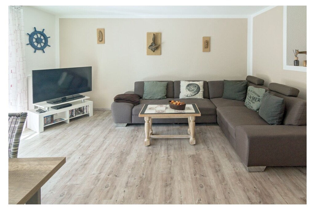 Apartment facilities
Living space
48 m², accommodation for 2+1 people, private parking space, terrace with garden furniture
Kitchen
The fitted kitchen is presented in white piano lacquer and the furniture (dining area and sideboard, small table) is in solid oak style. In the comfortable kitchen you will find: dishwasher, refrigerator, freezer, oven, microwave, coffee pad and a filter coffee machine, ceramic hob, kitchenette, complete cooking utensils and toaster, even the very little ones can find space here thanks to the high chair that can be delivered.
As a special highlight, you will find a "stone raclette" in this holiday apartment for culinary enjoyment in the evening.
Living area
The pull-out corner sofa with sleeping function invites you to linger, comfortable seating for 4 people, flat screen TV (satellite TV with free reception of HD + programs) with a size of 48 inches and a BlueRay player including DVDs and BlueRays make an evening in front of the TV an experience. A music system with an iPod docking station and various books are also available here.
Dining area
Dining area, seating for 4 people, high chair that can be delivered
Bathroom
The beautiful bathroom offers you: toilet, shower, hair dryer, a modern washbasin combination, plenty of storage space as well as underfloor heating and a towel dryer.
Sleeping areas
Sofa bed in the living room, 1 bedroom with sleeping space for 2 people in a double bed, here too there is a new LED TV, this is supplemented by a BluRay player and the radio alarm clock is obligatory.
Storage room
Here you will find the washing machine and all other utensils such as a vacuum cleaner, dustpan & broom, clothes rack, ironing board, iron, books and toys for the children.
Outdoor area
There is a private parking space directly next to the house, the terrace is equipped with garden furniture including 4 comfortable garden chairs and a table. Behind the house