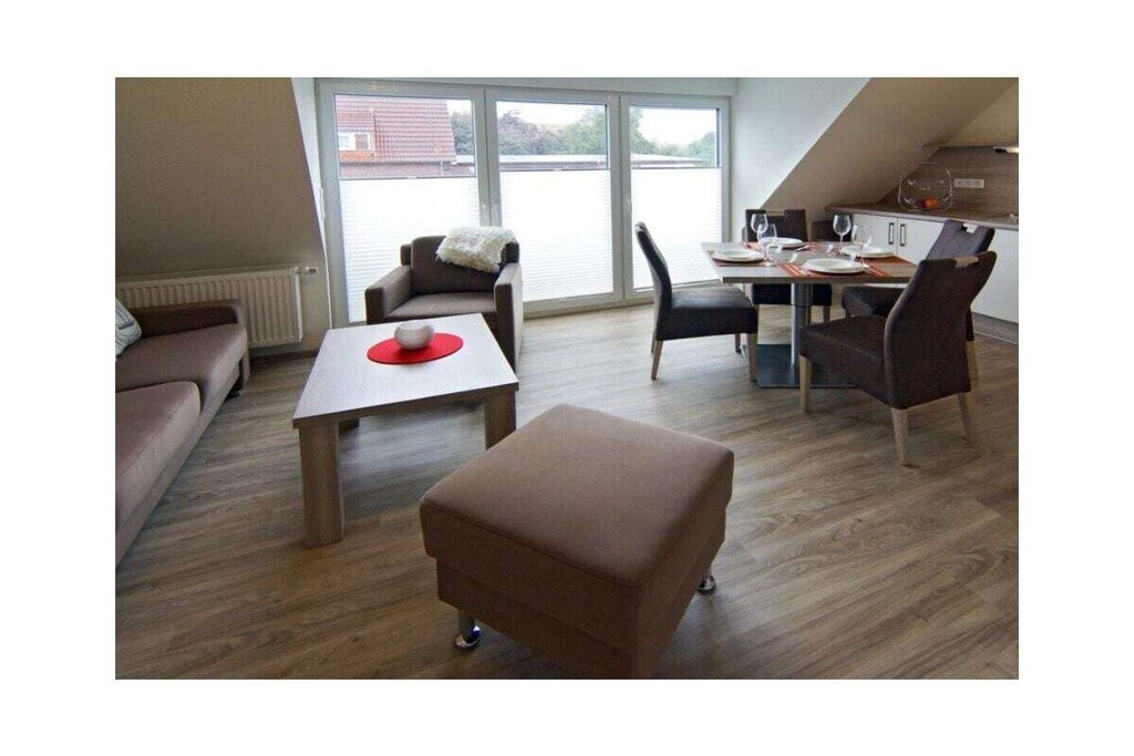 Holiday apartment Kettenstek
You can only feel completely comfortable on holiday in a well-kept and attractive ambience. This is what the holiday apartment Kettenstek offers you, an apartment in which you will not lack anything.
The spacious kitchen already exudes comfort. So that you can cook to your heart's content during your stay, the fitted kitchen has been equipped with every conceivable appliance and utensil. In addition to the usual appliances, this also includes a microwave and an integrated dishwasher.
In the living area you will find an inviting seating area, which looks very modern and at the same time cozy thanks to the cleverly selected decorations. Infotainment is well taken care of: a modern flat-screen TV including satellite system and DVD player are available here, as well as a music system for your entertainment. Game nights are also possible. Your holiday apartment has been equipped with a selection of board games for this purpose.
Two bedrooms offer space for a total of four people. One bedroom is equipped with a double bed, the other with two single beds that can optionally be pushed together to form a double bed. There would also be space for a baby travel bed if required. Both bedrooms are also equipped with a flat-screen TV, a special luxury of this apartment.
The bathroom is also a highlight - not only the chic design in white and granite is a special feature, but above all the comfortable underfloor heating. So nothing stands in the way of a stay in Norddeich even on cooler days.
For a carefree start to your vacation, book our linen package. This consists of bed linen, towels, shower mats, tea towels and a service set (toilet paper, dishwasher tablets, garbage bags, dish brush, cleaning cloths and other small helpers) for a carefree start to your vacation.