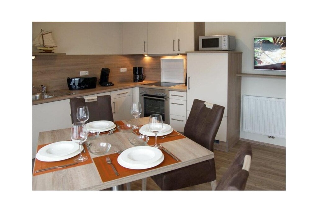 Ground floor: (Living room(single sofa bed, TV, radio, heating), Kitchen(hob, electric kettle, toaster, coffee machine, oven, microwave, dishwasher, fridge, freezer, high chair), bedroom(double bed, cot), bathroom(shower, washbasin, hairdryer))\n\nInternet Access DSL, Vacuum Cleaner, hallway(Wardrobe Coatrack), storage, Internet access, Internet access, tumble dryer, washing machine, balcony(balcony), garden furniture, iron, drying cabinet, parking (paying)