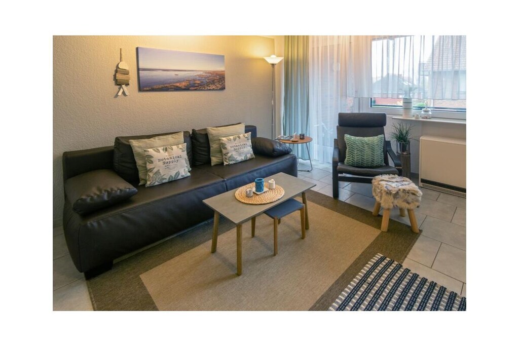 Holiday apartment Hygge, Deichstraße 14, Norddeich, 1st floor
Norddeich, the district of the East Frisian town of Norden that is probably best known among tourists, is inviting at any time of year and promises the best relaxation. Here you don't have to travel far to find everything you need for a perfect holiday: fresh air, wide sandy beaches, a wide range of shopping opportunities and appealing restaurants.
The holiday apartment
Deichstraße is located directly behind the wonderful Norddeich beach. Here, in an apartment building, the property is on the 1st floor - easily accessible via a few steps.
"Hygge" is a Danish word and describes this unique feeling of well-being in a cozy, "homely" atmosphere. Linguists suspect that the English word "hug" also comes from this term. And so your holiday apartment Hygge lives up to its name by welcoming you with its cozy charm.
The spacious living and dining area invites you to relax wonderfully after long walks on the beach. And even rainy days are bearable in the beautiful ambience. The furnishings were designed with functionality in mind as well as selected, loving details. Relax on the comfortable sofa and enjoy quiet evenings watching TV with the whole family. A modern TV, a satellite system and a DVD player are of course available.
The path leads you directly from the living room to the balcony, which is equipped with a practical seating area. Here you can sit and enjoy the soothing North Sea air.
The spacious kitchenette integrated into the living area offers all the necessary comfort for cooking and eating together. The equipment includes a ceramic hob, an oven, a refrigerator, a coffee machine, a microwave, a toaster and plenty of dishes, cutlery and glasses. The dining table has space for up to