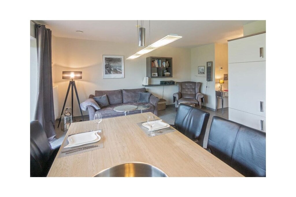 Ground floor: (Living room(TV, radio), Kitchen(hob, electric kettle, toaster, coffee machine, oven, microwave, dishwasher, fridge, freezer), bedroom(double bed), bathroom(shower, toilet, hairdryer))\n\nwashing machine, parking