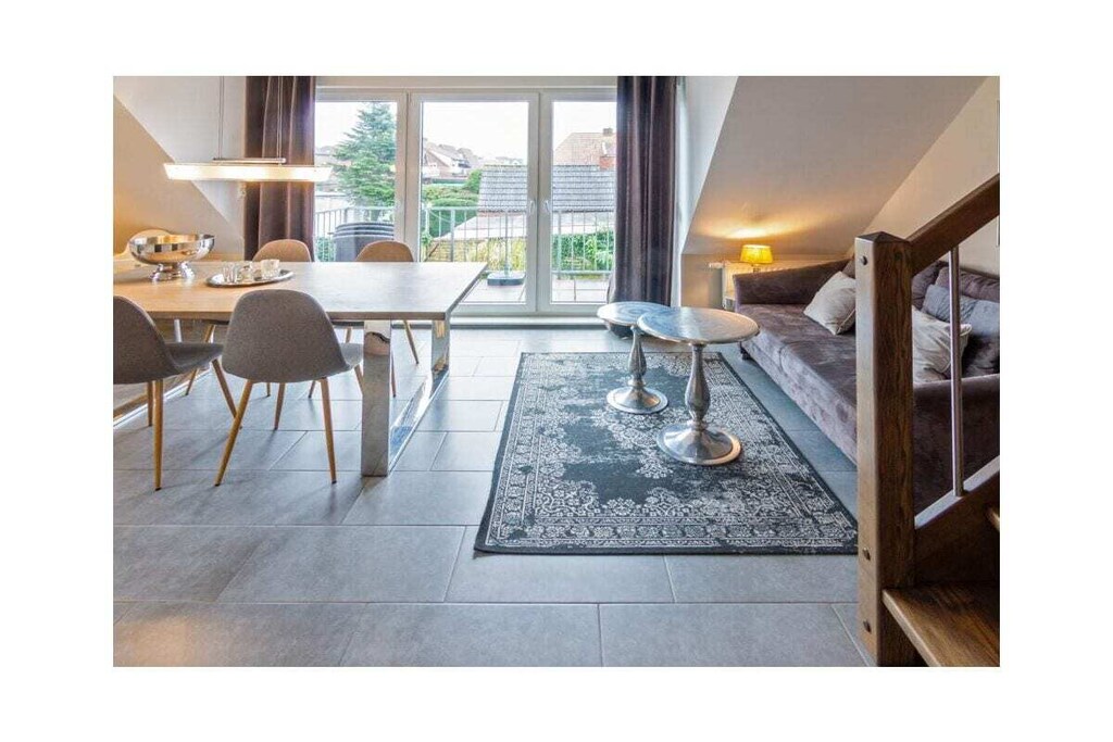 Ground floor: (hallway, Living room(TV, radio), Kitchen(hob, electric kettle, toaster, coffee machine, oven, microwave, dishwasher, fridge, freezer), bedroom(double bed), bedroom(double bed), bathroom(shower, toilet, hairdryer))\n\nwashing machine, balcony, garden furniture, parking