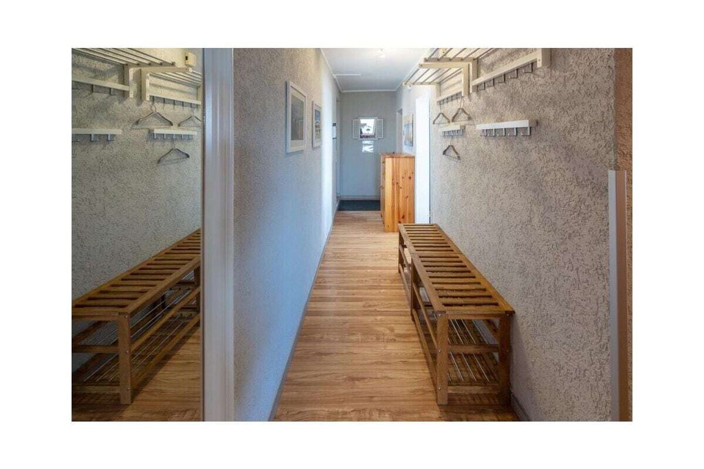 Ground floor: (Living room(TV, radio), Kitchen(hob, electric kettle, toaster, coffee machine, oven, microwave, dishwasher, fridge, freezer), bedroom(double bed), bedroom(double bed), bathroom(shower, toilet, hairdryer))\n\nbalcony, garden furniture, parking, awning