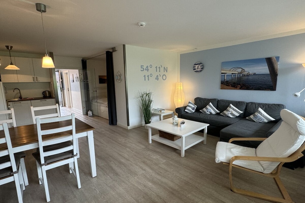 mezzanine: (hallway(Mirror, Wardrobe Coatrack), Living/diningroom(Armchair, Games, Mixer, Sofa, Wardrobe, Kitchenette, library, double bed, TV, dining table, stove, DVD player, DVD player, Blu-ray player, radio, CD player, stereo unit, hob, electric kettle, toaster, cooker, coffee machine, oven, microwave, dishwasher, fridge, freezer, high chair), bedroom(single bed, single bed, insect screens), bathroom(Mirror, toilet, shower, shower, washbasin, heating, hairdryer))\n\nFire Alarm, Hot Water, Internet Access DSL, Vacuum Cleaner, Internet access, First Aid, balcony(Sun Umbrella, balcony), heating, parking, drying cabinet