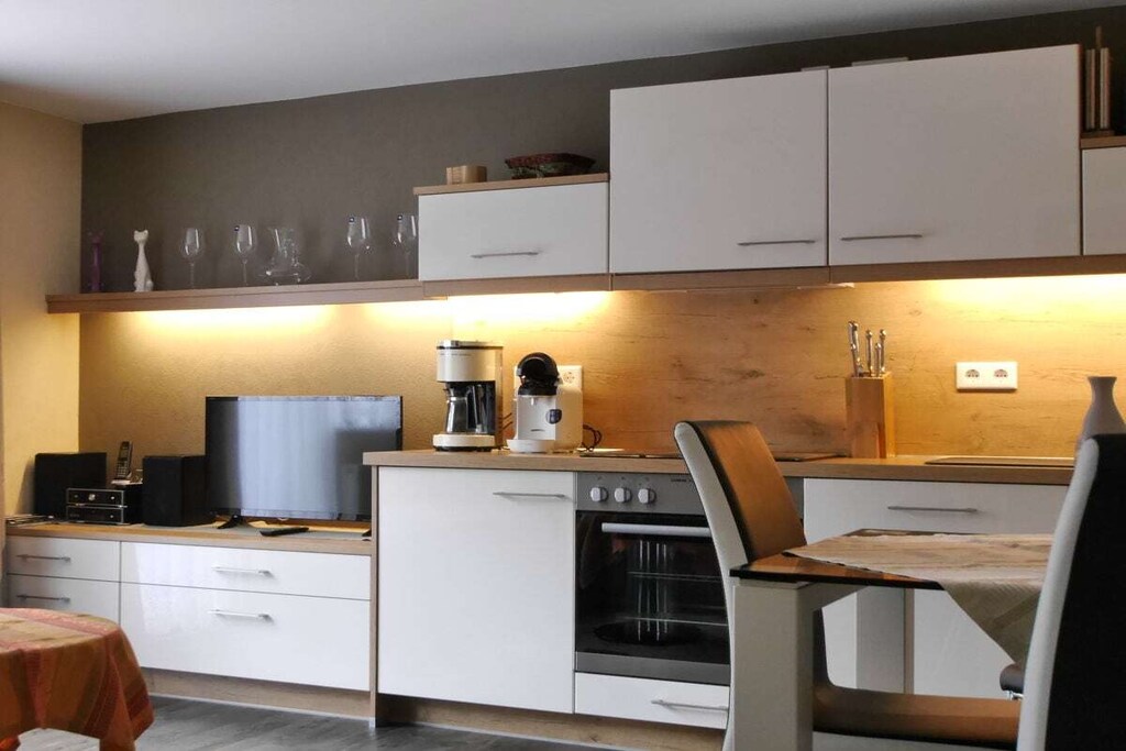 Ground floor: (hallway(Mirror, Wardrobe Coatrack), open kitchen(Sofa, Kitchenette, single sofa bed, TV, dining table, DVD player, radio, CD player, stereo unit, hob, electric kettle, coffee machine, oven, dishwasher, fridge, freezer, high chair), bedroom(Bed Linen, Wardrobe, double bed, TV), bathroom(Mirror, toilet, shower, washbasin, heating, hairdryer, Towels incl.))\n\nFire Alarm, Internet access, heating, terrace(Sun Umbrella, grill, garden furniture, pond), parking, telephone