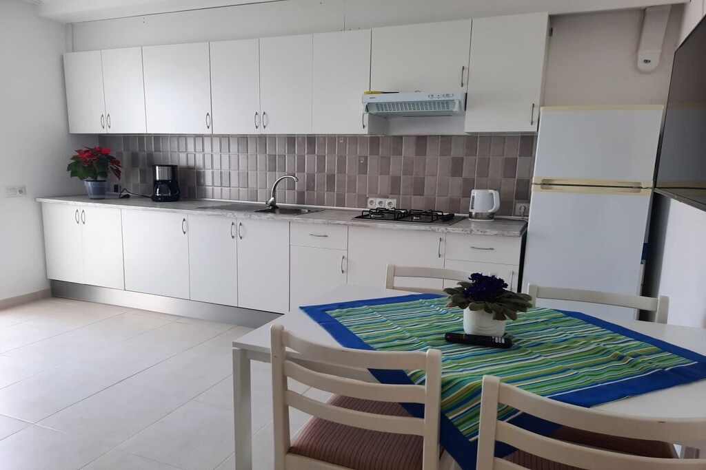 Ground floor: (open kitchen(Kitchenette, TV, electric kettle, cooker, coffee machine, fridge, freezer), bedroom(Bed Linen, Wardrobe, double bed, TV), bathroom(Mirror, toilet, shower, washbasin, Towels incl.))\n\nHot Water, Internet Access DSL, Internet access, terrace(garden furniture, sun loungers, awning), garden(outdoor shower, garden furniture, sun loungers, swimming pool), parking, drying cabinet