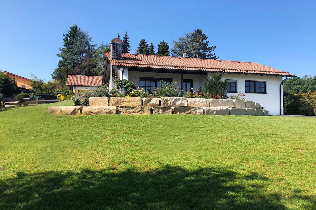 Are you looking for a trade fair / holiday apartment to feel good in? 
Would you like to enjoy the peace and quiet and relax after a busy day at the trade fair? We offer you the perfect holiday homes near the Nuremberg exhibition center. Or you can also enjoy our quiet apartment near the Nuremberg trade fair. The choice is yours. 
The holiday home's furnishings, e.g. terracotta tiles, real brass fittings on the windows and doors, lattice windows, wall and ceiling lights and curtains, are reminiscent of Tuscany. It is equipped with real wood parquet and decorated with loving details. All rooms are fully furnished and equipped to a high standard, as are the terraces. The holiday home also has an open fireplace in the living room and on the terrace, as well as a tiled stove in the kitchen. It also has central heating and partly underfloor heating.
There is also a small apartment for 1-2 people in the basement, which can be rented separately from the main house. It is also fully equipped to a high standard.