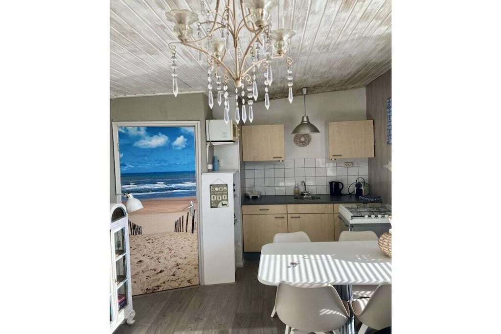 Ground floor: (Living room(Armchair, TV, seating area), Kitchen(stove, cooker, oven, fridge, dishes and cutlery), bedroom(single bed, single bed), bedroom(Wardrobe, bunk bed), bathroom(Mirror, toilet, shower, washbasin))\n\nInternet access, Internet access, terrace(garden furniture)