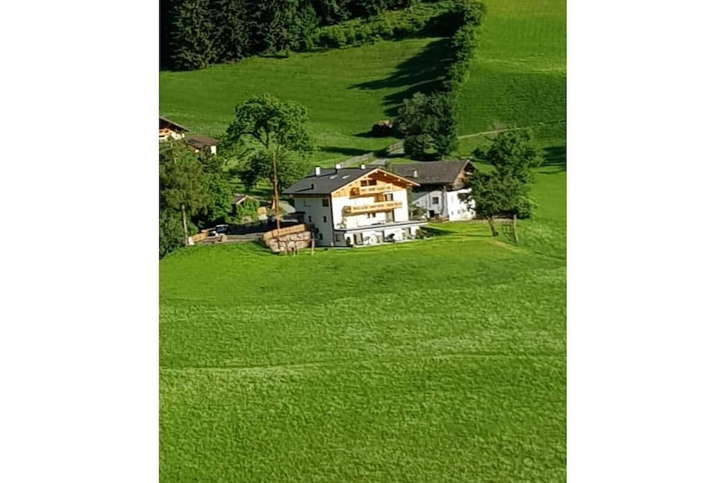 On the 1st floor: (open kitchen(Tea Towels, Kitchenette, TV, dining table, stove, hob, cooker, coffee machine, oven, dishwasher, fridge, freezer, freezer, heating), bedroom(double bed, heating), bedroom(single bed, single bed, heating), Children\'s bedroom(single bed, single bed, heating), bathroom(Mirror, toilet, shower, washbasin, bidet, heating))\n\nHot Water, Safe, Vacuum Cleaner, Internet access, Internet access, tumble dryer, washing machine, balcony, heating, garden(Barbecue center, Lawn, garden furniture, sun loungers, Garden shed), parking, drying cabinet