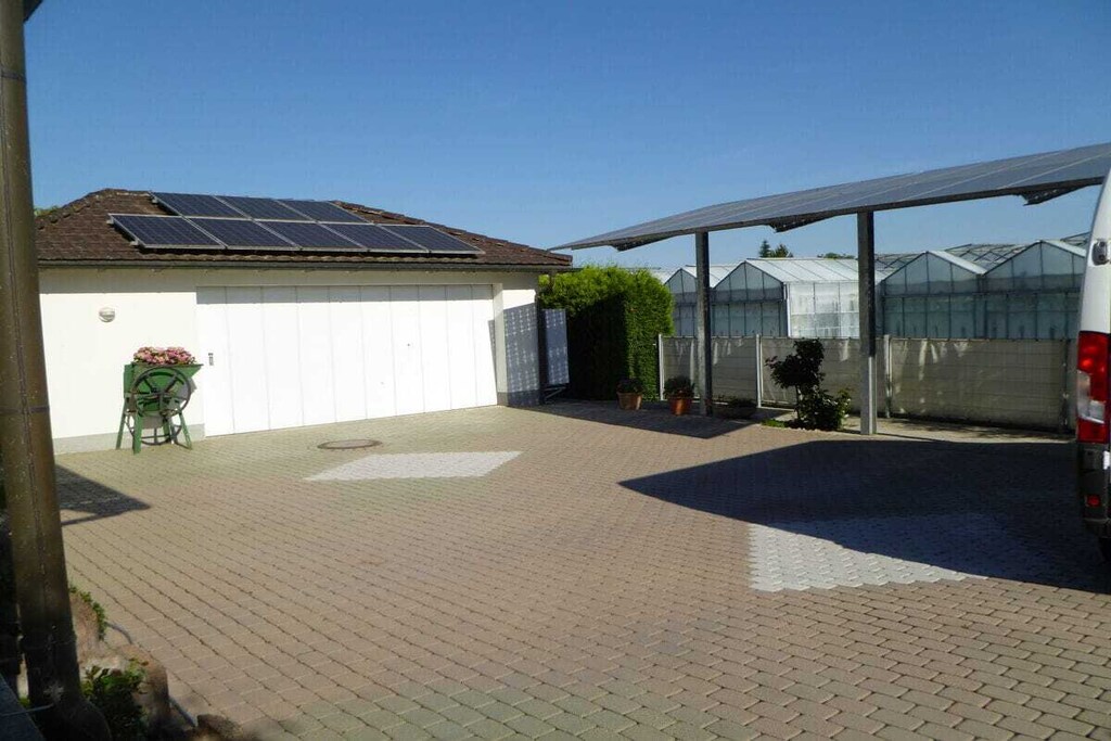 Ground floor: (Living room(Armchair, TV, fireplace, heating), bedroom(Bed Linen, Wardrobe, double bed, TV, radio, heating, air conditioning), bedroom(Bed Linen, Wardrobe, single bed, single bed, TV, radio, heating, air conditioning))\n\nFire Alarm, Hot Water, Internet Access DSL, Internet Access ISDN, Safe, Vacuum Cleaner, garage, carport, Internet access, Internet access, First Aid, tumble dryer, washing machine, heating, parking, ironing board, iron, drying cabinet, Laundry Package for a fee, Alarm