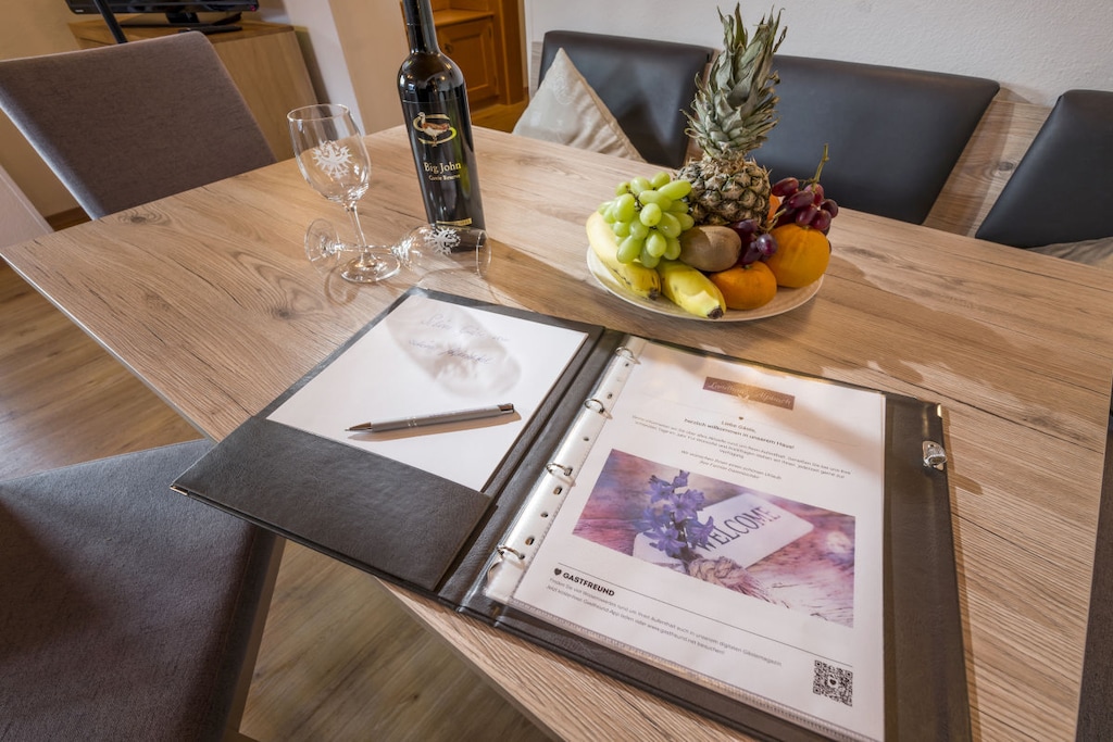 Ground floor: (Kitchen(stove, hob, oven, dishwasher, fridge, heating), Living/diningroom(TV, dining table, oven), bedroom(Bed Linen, Wardrobe, double bed, heating), bedroom(Bed Linen, Wardrobe, double bed, heating), bathroom(Mirror, shower, washbasin, toilet, heating))\n\nHot Water, Internet Access DSL, Safe, garage, Internet access, Internet access, balcony(garden furniture, sun loungers), heating, parking, drying cabinet, telephone