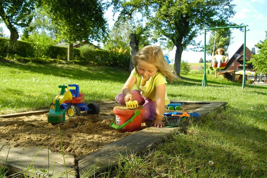 Attic: (open kitchen(Spices, Tea Towels, Kitchenette, dining table, stove, hob, electric kettle, toaster, cooker, coffee machine, oven, dishwasher, fridge, freezer, insect screens), Living/diningroom(Armchair, Games, Socket Covers, Sofa, Wardrobe Coatrack, library, TV, TV, dining table, radio, high chair, insect screens), bedroom(Bed Linen, Wardrobe, single folding bed, double bed, double bed, TV, TV, radio, cot, children\'s bed, insect screens), bedroom(Bed Linen, Wardrobe, single folding bed, double bed, double bed, TV, TV, radio, cot, children\'s bed, insect screens), bathroom(Mirror, toilet, outdoor shower, shower, washbasin, hairdryer, insect screens), bathroom(Mirror, toilet, outdoor shower, shower, washbasin, hairdryer, insect screens))\n\nFire Alarm, Hot Water, Internet Access ISDN, Vacuum Cleaner, Internet access, Internet access, First Aid, heating, terrace(Sun Umbrella, grill, grill, garden furniture, sun loungers), parking, drying cabinet