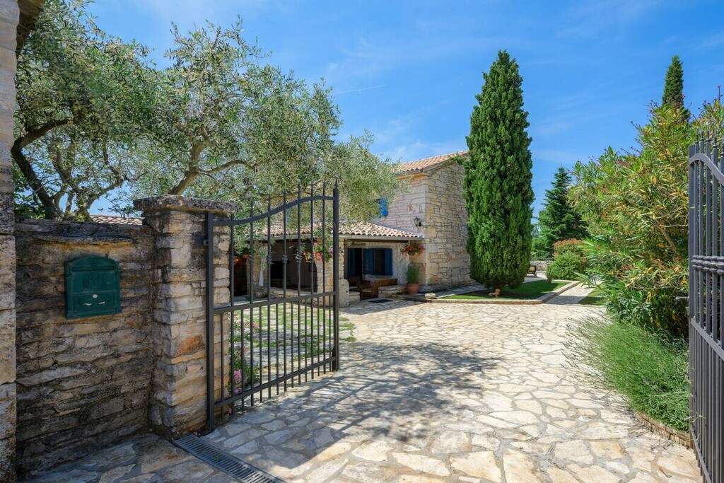 Living room(Fan, TV, fireplace), Kitchen(electric kettle, toaster, coffee machine, oven, dishwasher, fridge, freezer, Food processor), bedroom(double bed), bedroom(single bed, single bed), bathroom(bath tub, washbasin, toilet), guest toilet, relaxation area(swimming pool), grill, tumble dryer, washing machine, balcony(balcony), terrace(terrace), garden furniture, parking, iron