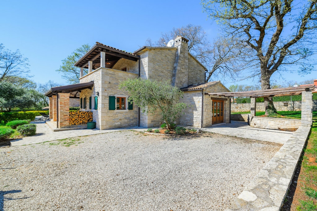 Safe, Living room(double sofa bed, TV, fireplace, seating area), Kitchen(stove, electric kettle, toaster, coffee machine, oven, microwave, dishwasher, fridge, freezer, Food processor), bedroom(double bed), bedroom(double bed), bedroom(double bed), bathroom(bath tub, shower, toilet), bathroom(shower, washbasin, toilet), bathroom(shower, washbasin, toilet), relaxation area(swimming pool), grill, tumble dryer, washing machine, balcony(balcony), terrace(terrace), garden furniture, parking, iron