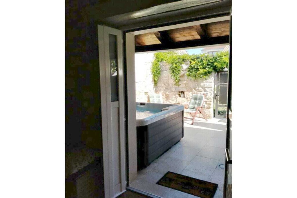 The holiday home Casa Nini with private jacuzzi is located in Porec and has 2 bedrooms and can accommodate 4 people.

This lovely and sunny 80 mÂ² property features a great view of the garden.

The property is located 0 m from the golf course, 0 m from the ski resort, 50 m from the supermarket, 50 m from Brioni, 300 m from Mica Konoba, 3 km from Aquacolors Porec water park, 6 km from Porec city, 6 km from Porec bus station, 7 km from Zelena Laguna sandy beach, 7 km from Zelena Laguna pebble beach, 25 km from Istarske Toplice, 60 km from Pula airport, and 60 km from Pula train station. The property is in an ideal family-friendly and rural setting.

The accommodation is equipped with a garden, garden furniture, fenced garden, 40 mÂ² terrace, barbecue, fireplace, iron, internet (Wi-Fi), hair dryer, central heating, air-conditioned, open-air parking near the building, 1 TV, satellite TV (Languages: English, German), DVD player.

The vitroceramic open-plan kitchen is equipped with a refrigerator, microwave, freezer, washing machine, dishes/cutlery, kitchen utensils, coffee machine, toaster and kettle.