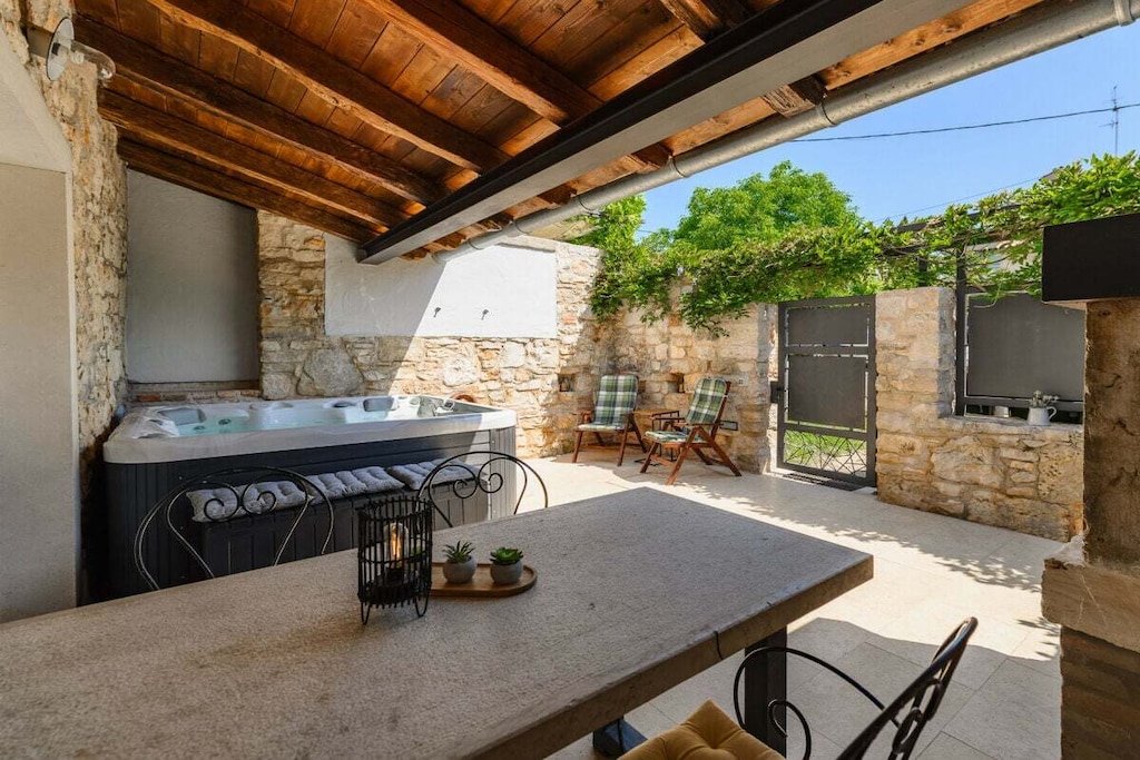 Hot Water, Living room(TV, fireplace, DVD player), Kitchen(electric kettle, toaster, coffee machine, microwave, fridge, freezer), bedroom(Bed Linen, Wardrobe, double king size bed, double king size bed), bedroom(Bed Linen, Wardrobe, double king size bed, double king size bed), bathroom(Mirror, toilet, shower, washbasin, hairdryer), guest toilet(Mirror, toilet, washbasin), Internet access, Internet access, washing machine, terrace(Sun Umbrella, hot tub, garden furniture, sun loungers), parking, iron