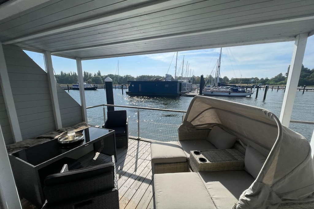 This large houseboat is moored in the wonderfully tranquil marina at Schwedenschanze in Stralsund.

"Sophie" features a spacious living room and two bedrooms with a total of five beds. A very comfortable sofa bed in the living room allows for an additional guest. Access to the houseboat is via a gangplank and a small set of steps, and "Sophie" is available year-round. A sheltered lower deck and a generous rooftop sun deck with loungers and 360-degree panoramic views enhance the comfort of this houseboat.

"Sophie" is a new houseboat, modernly and luxuriously furnished. It is moored in a very quiet marina in Stralsund.
