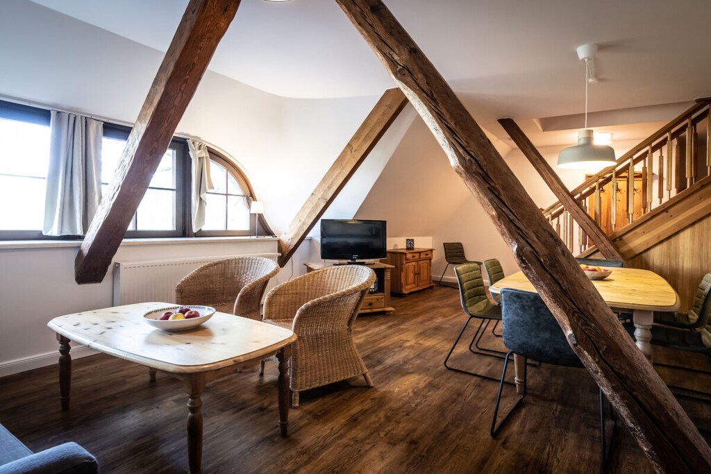 On the 1st floor: (Kitchen(stove, oven, dishwasher, fridge, dishes and cutlery), Living/bed room(Armchair, single sofa bed, TV, dining table), bedroom(double bed), bathroom(toilet, shower, washbasin))\n\nOn the 2nd floor: (bedroom(single bed, double bed, children\'s bed), bedroom(double bed))\n\nFire Alarm, Internet access, Internet access, washing machine, garden(Barbecue center, Lawn, fireplace, grill, garden furniture, sun loungers, slide, Garden shed, Swing set)