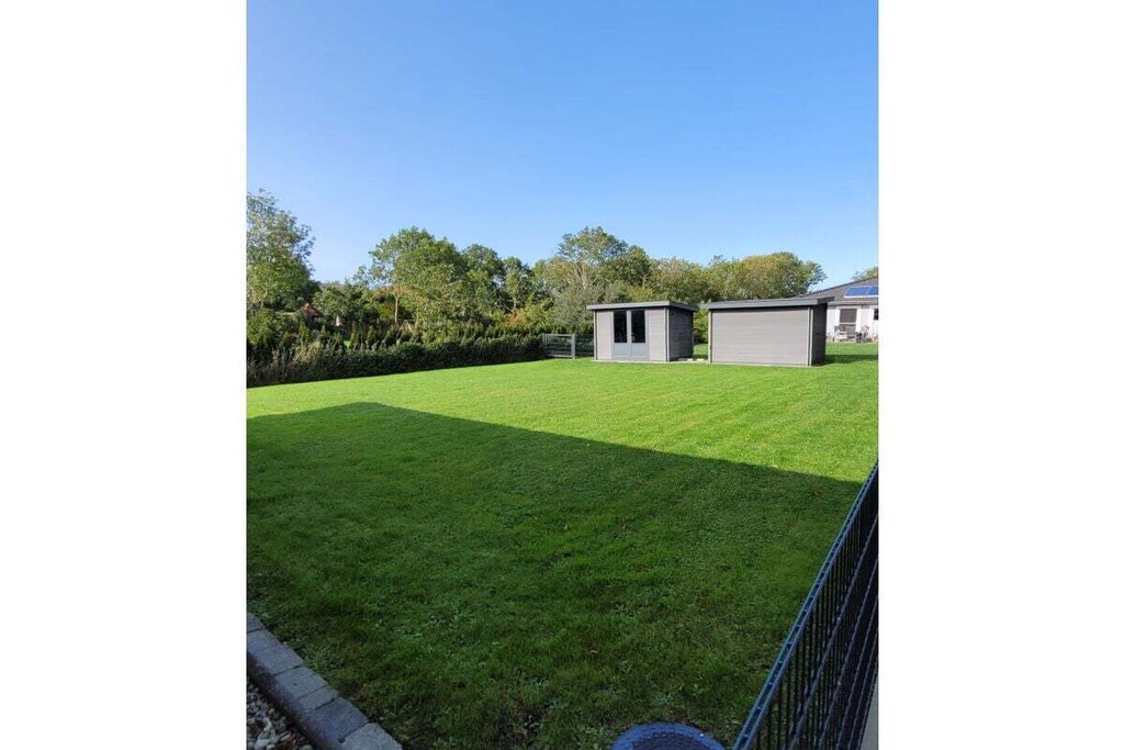 Ground floor: (Kitchen(hob, electric kettle, toaster, coffee machine, oven, microwave, dishwasher, fridge, washing machine, dishes and cutlery), Living/diningroom(TV, dining table, fireplace, stereo unit, insect screens), bedroom(Wardrobe, single bed, single bed), bedroom(Wardrobe, double bed), bedroom(Wardrobe, double bed), bathroom(toilet, sauna, shower, washbasin, hairdryer), bathroom(toilet, sauna, shower, washbasin, hairdryer))\n\nHot Water, Vacuum Cleaner, Internet access, washing machine, washing machine, heating, terrace(Sun Umbrella, grill, garden furniture), parking, ironing board, iron, drying cabinet