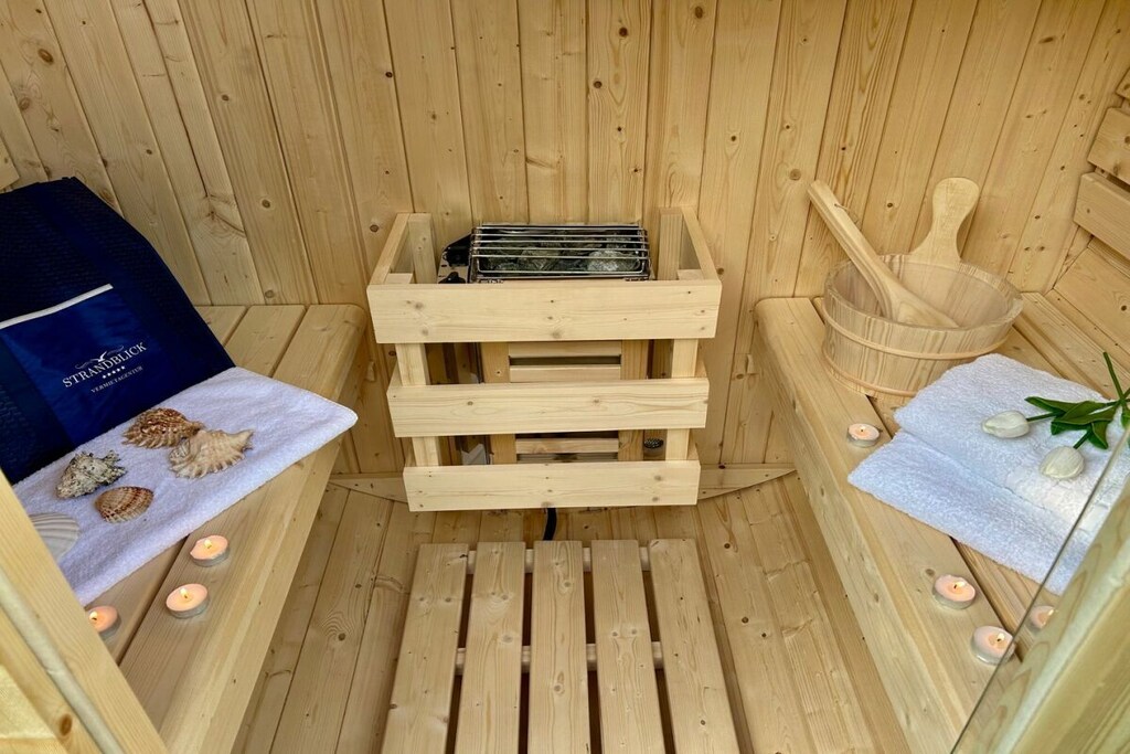 Ground floor: (Kitchen(stove, hob, cooker, oven, dishwasher, fridge, heating), bathroom(toilet, shower, washbasin, heating))\n\nOn the 1st floor: (bedroom(Wardrobe, double bed, TV, heating), bedroom(Wardrobe, single bed, single bed, TV, heating), bathroom(Mirror, toilet, shower, washbasin, heating))\n\nHot Water, Internet Access DSL, Safe, Vacuum Cleaner, Living room(TV, fireplace, heating), bedroom(Wardrobe, double bed, heating), bathroom(Mirror, toilet, shower, washbasin, heating), Internet access, First Aid, washing machine, heating, garden(sauna, Barbecue center, garden furniture), parking, ironing board, iron