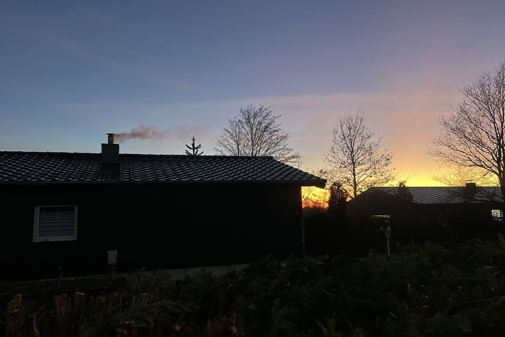 Fire Alarm, Hot Water, Internet Access DSL, Vacuum Cleaner, hallway(Wardrobe Coatrack), Kitchen(Tea Towels, hob, toaster, cooker, coffee machine, oven, microwave, dishwasher, fridge, freezer, cot, washing machine), Living/bed room(single sofa bed), Living/diningroom(Games, single sofa bed, TV, dining table, fireplace, stove, radio), bedroom(Wardrobe, double bed, cot), bedroom(Wardrobe, double bed), bathroom(Mirror, toilet, bath tub, shower, washbasin, washing machine, hairdryer), guest toilet(Mirror, toilet, washbasin), Internet access, Internet access, washing machine, heating, terrace(Lawn, grill, hot tub, garden furniture, sun loungers), parking, drying cabinet