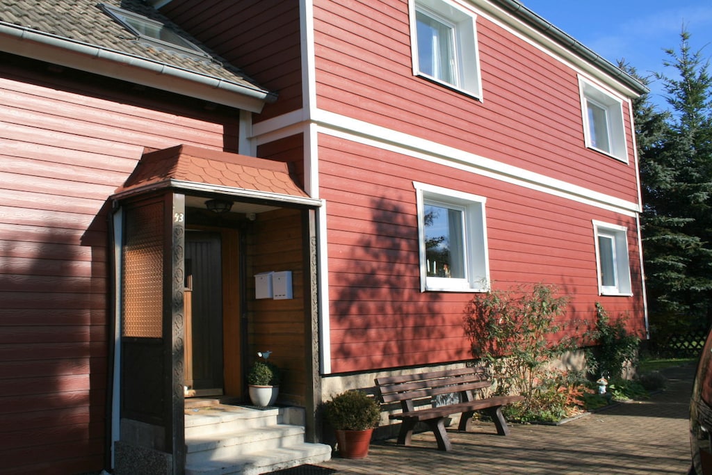 Our holiday apartment is located on the first floor.

The living and dining room is connected by a double sliding door. Smart TV and free Wi-Fi are provided.

The well-equipped kitchen includes a refrigerator with freezer compartment, a ceramic hob and oven, a dishwasher, and a microwave. A kettle, coffee maker, toaster, and other kitchen utensils are also provided.

One bedroom has a double bed (2 x 2 m) and a cot (1.40 m x 0.70 m). A second double bed (1.80 m x 2.00 m) is located in the second bedroom.

The bathroom has a shower.

Garden furniture is available for your use in the garden.