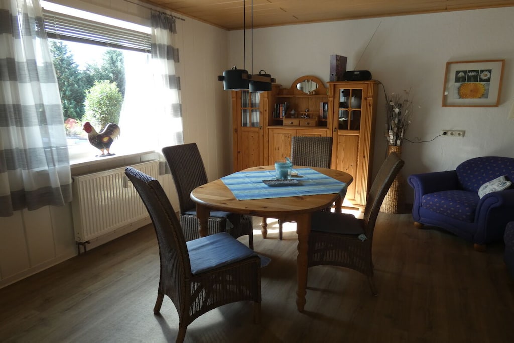 Ground floor: (hallway(Mirror, Wardrobe Coatrack), Kitchen(Mixer, Spices, Tea Towels, Kitchenette, stove, hob, electric kettle, toaster, coffee machine, oven, microwave, dishwasher, fridge), Living/diningroom(Sofa, TV, dining table, stove, DVD player, radio), bedroom(Bed Linen, Wardrobe, double bed, radio), bedroom(single bed, double bed), bathroom(Mirror, toilet, bath tub, shower, washbasin, washing machine))\n\nHot Water, Vacuum Cleaner, Internet access, First Aid, heating, garden(Barbecue center, garden furniture), parking, ironing board, iron, drying cabinet