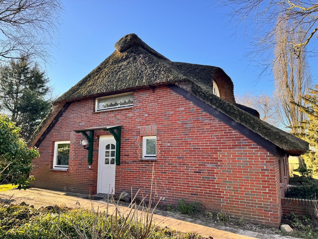 Vakantieappartement in een rietgedekt huis, Burhave
