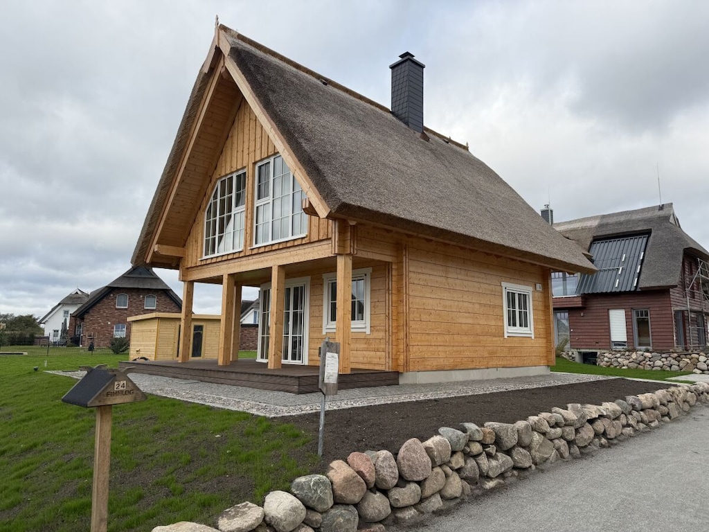 Houten huis aan de haven 24