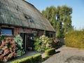 Malerisches Bauernhaus in Eede mit Blick auf die Obstgärten