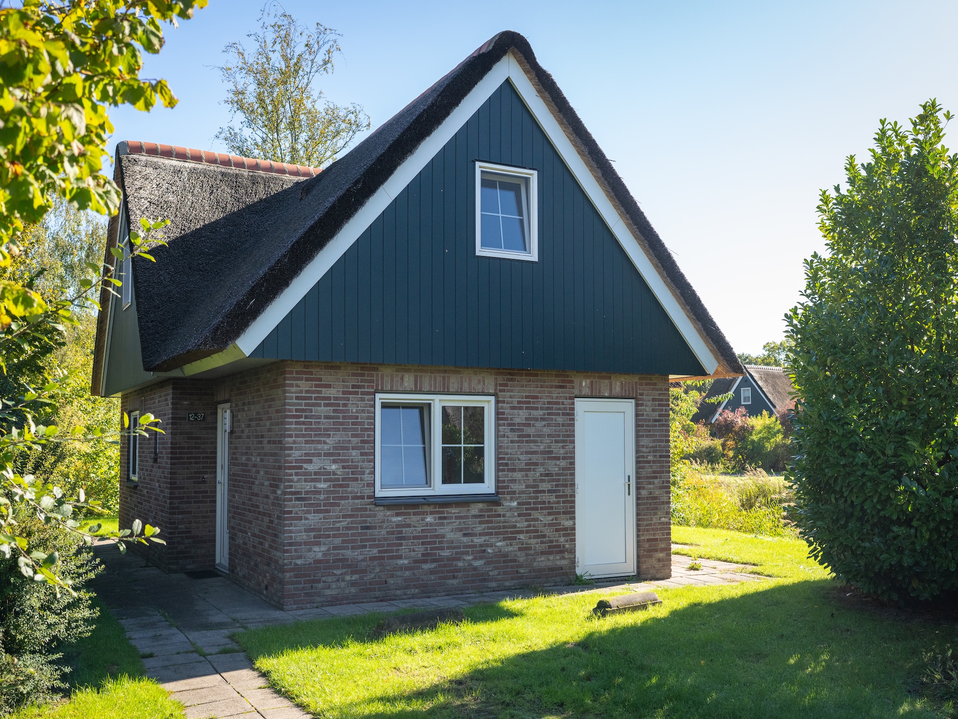 Vrijstaande rietgedekte villa met tuin in hartje Weerribben - foto 41