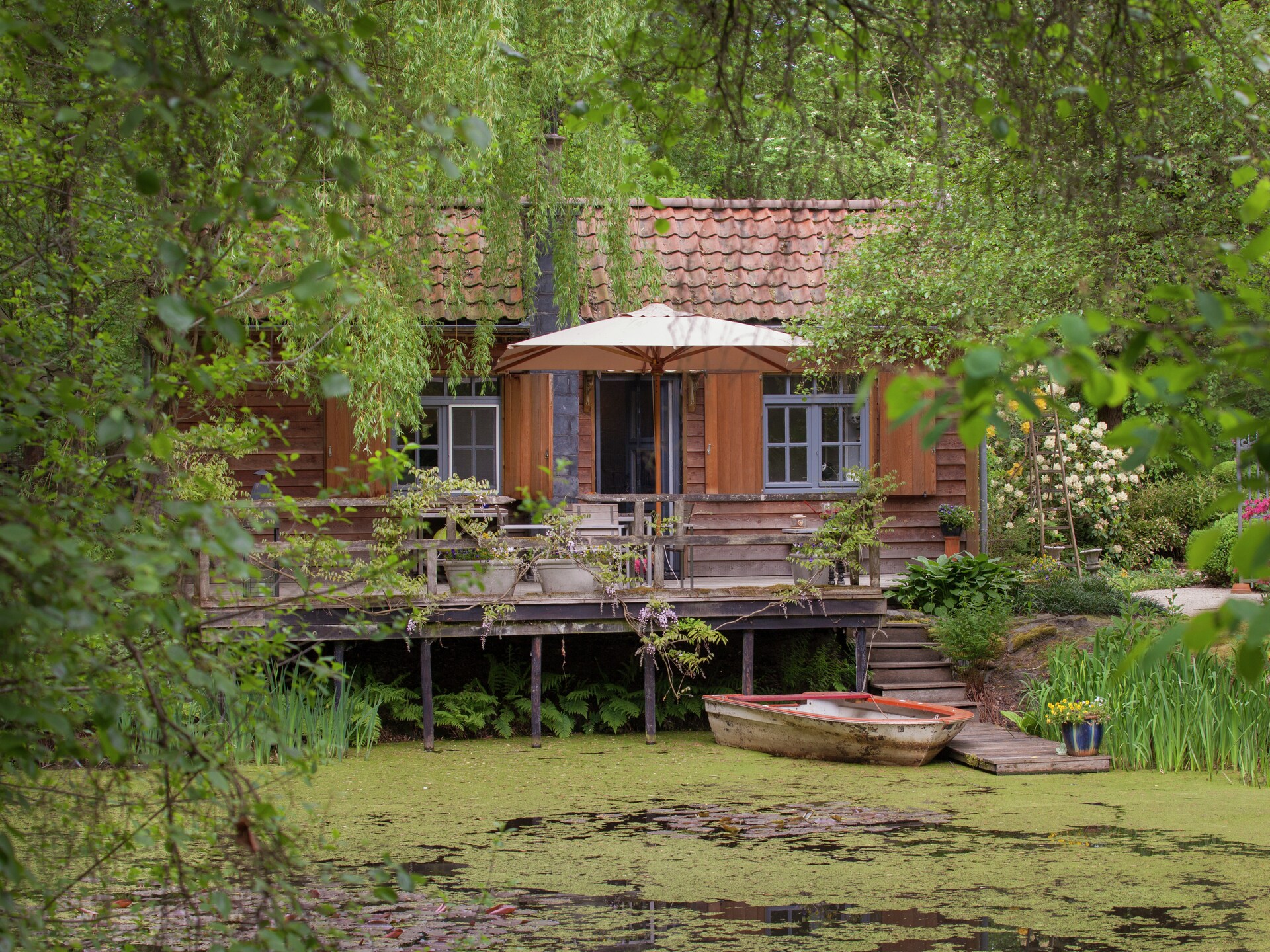 Boschalet aan het water met eigen visstek in Opglabbeek - foto 8