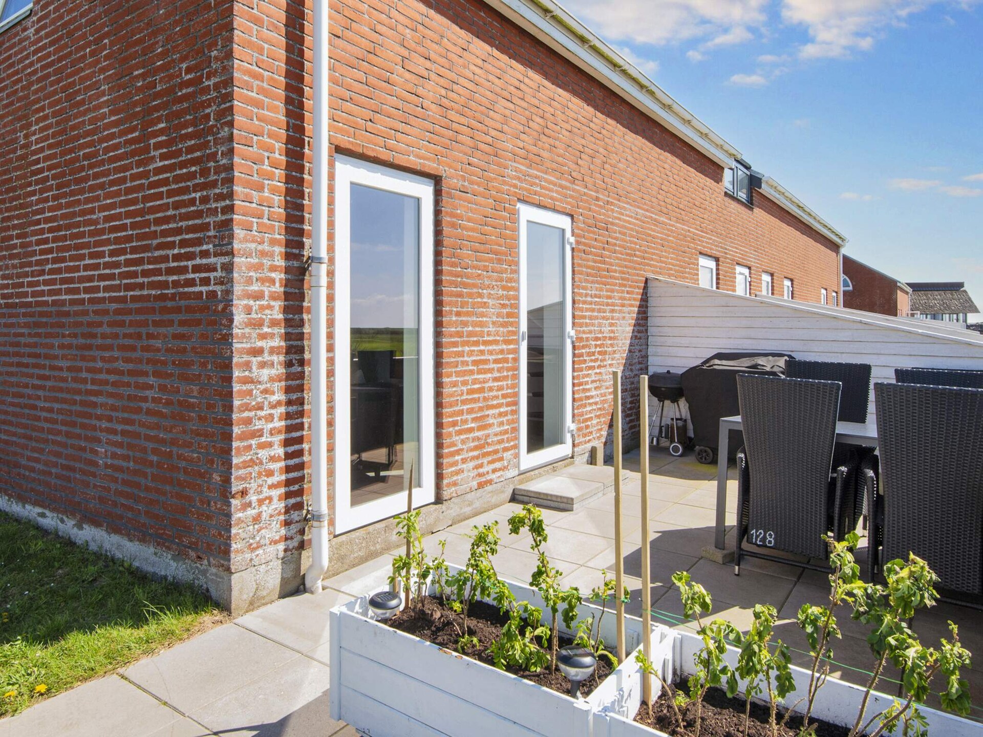 Licht hoekhuis op Rømø met zonnig terras en zicht op golfbaan - foto 33