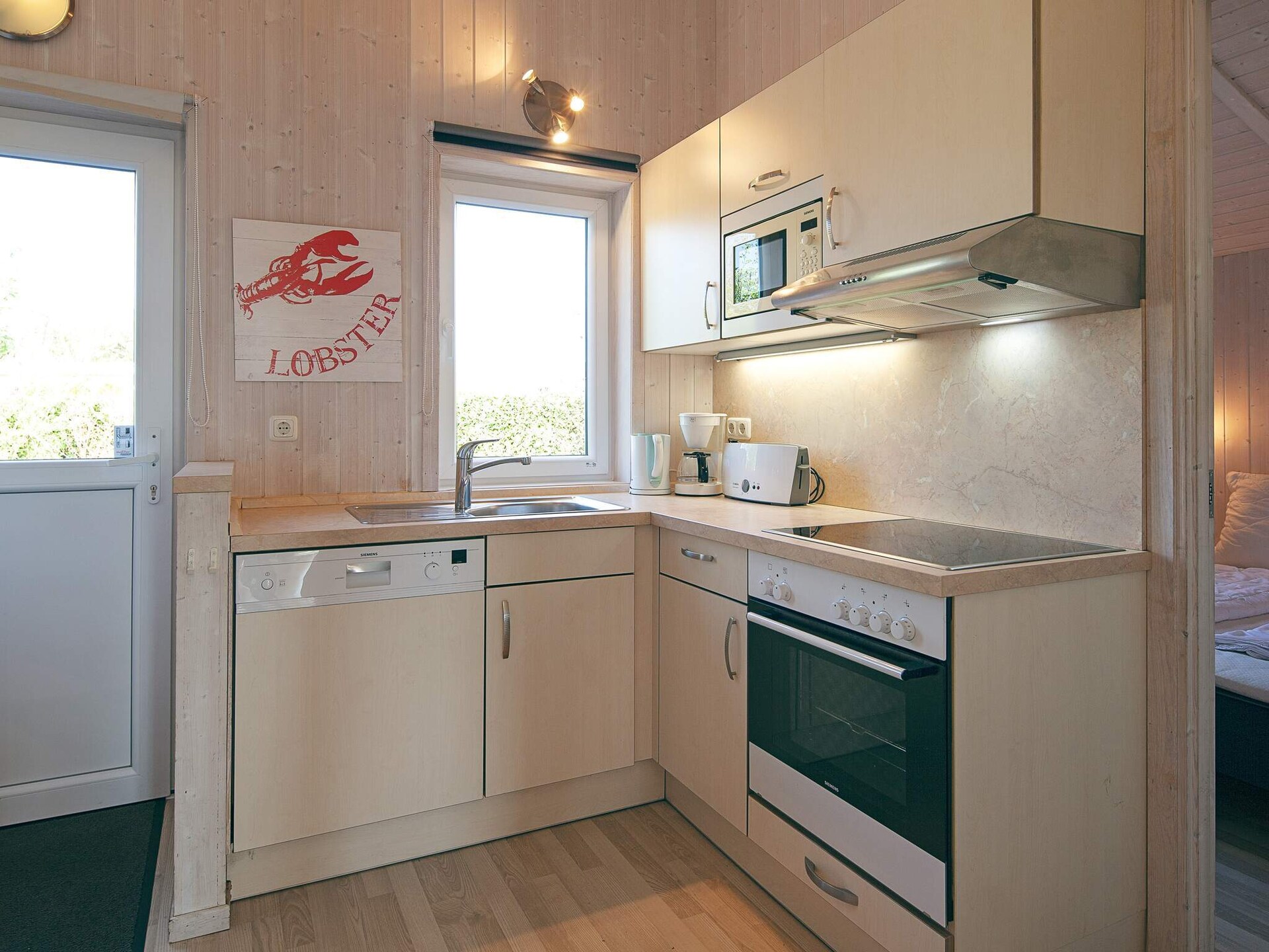 Licht Scandinavisch vakantiehuis met sauna en whirlpool, 250m van zee - foto 12