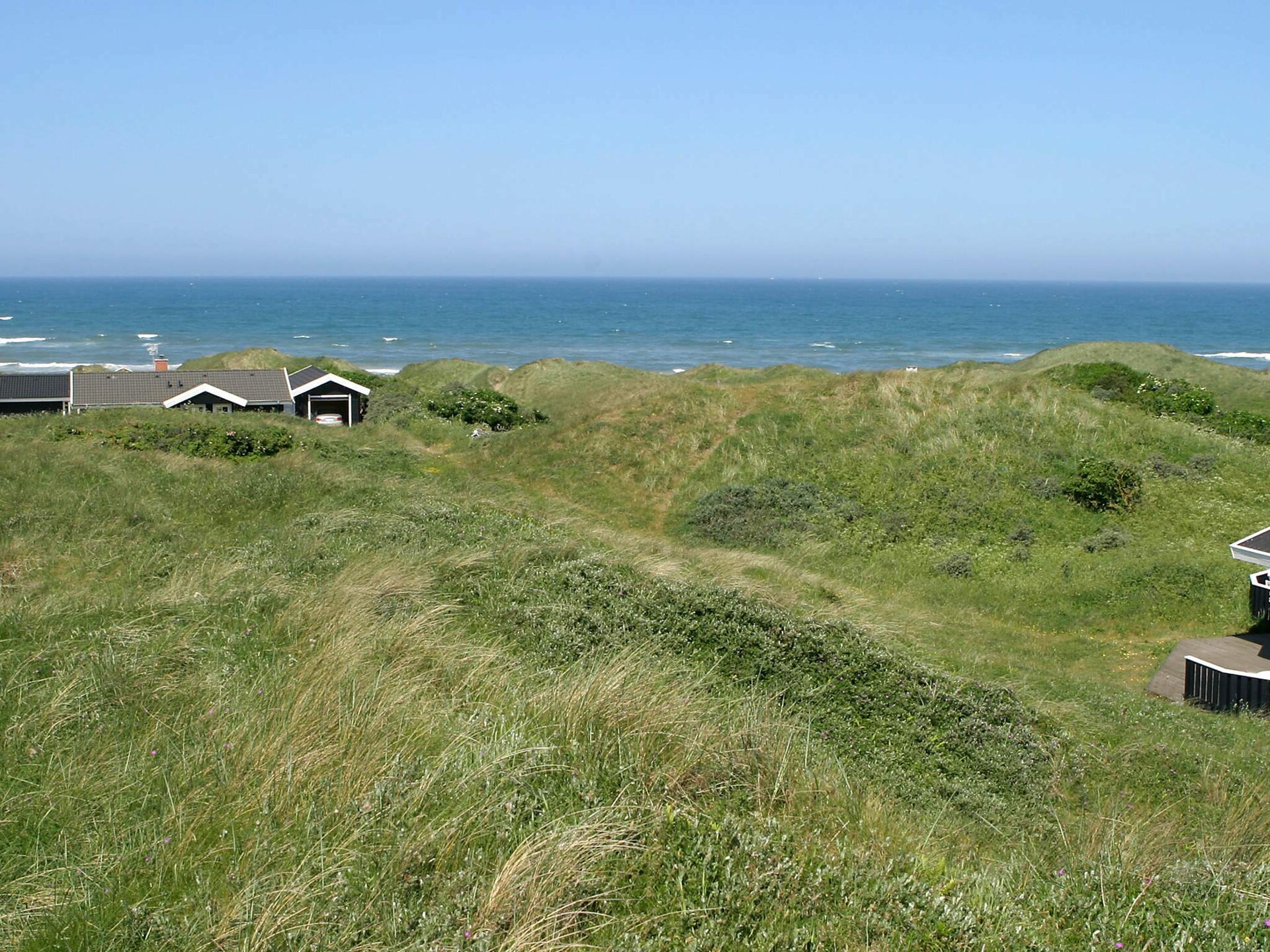 Knus houten huis in de duinen bij Tornby Strand op 500 meter - foto 33