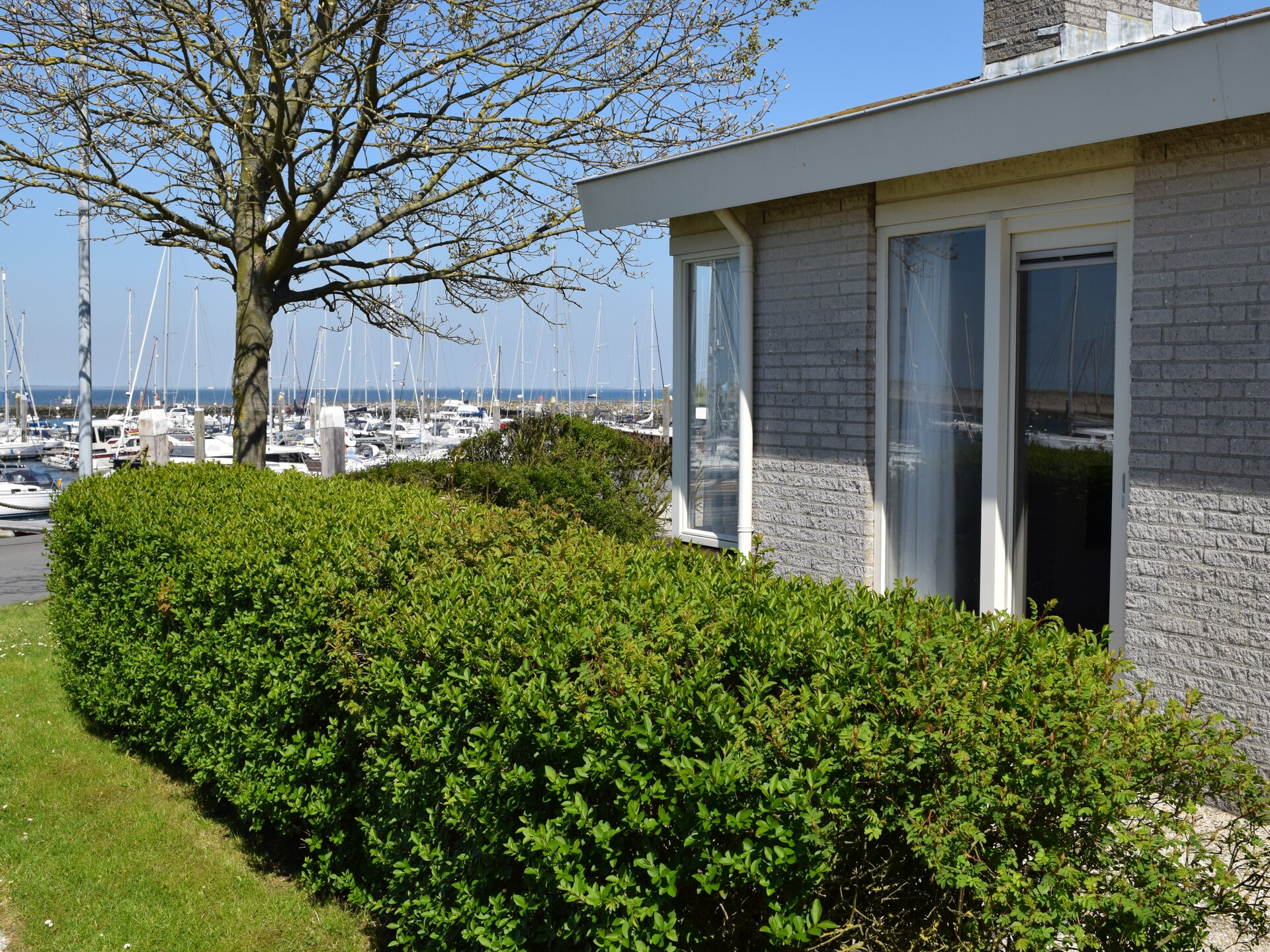 Vrijstaande bungalow met uitzicht over jachthaven en Oosterschelde - foto 9
