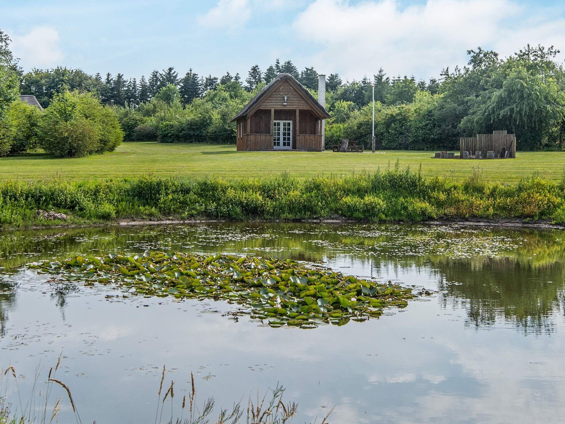 Reetgedekt vakantiehuis voor 18 personen met privémeer en jachthut op 10 meter van zee - foto 10
